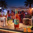 Kinnie Rumba Flasche 250 ml als 16er-Pack, im Hintergrund eine Strandbar auf Malta